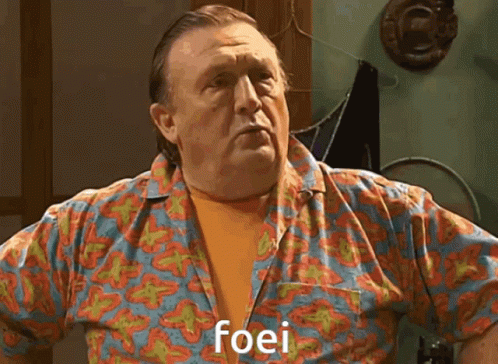 Man In Brown Shirt Saying Fine Stout To Man GIF