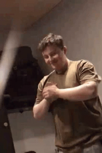Man In Brown Shirt Smiling GIF