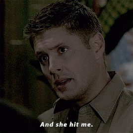 Man In Brown Shirt Talking On Cell Phone She Hit Me GIF