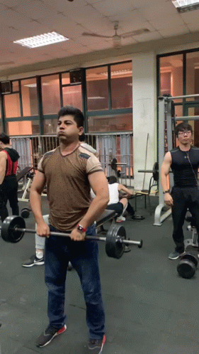 Man In Brown Starts Workout With Barbell Row GIF