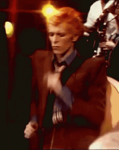 Man In Brown Suit And Blue Shirt Dancing GIF