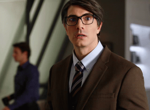 Man in Brown Suit Surprised