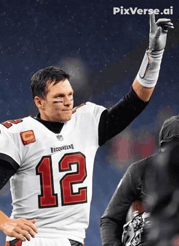 Man in Buccaneers Jersey Raising Hand