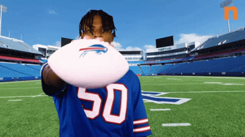 Man in Buffalo Bills Jersey Holding Frisbee