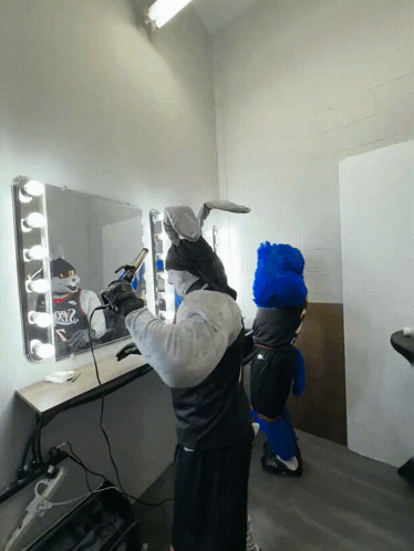 Man In Bunny Costume Blow Drying Hair GIF