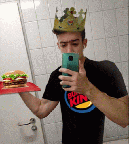 Man in Burger King T-Shirt Taking Selfie