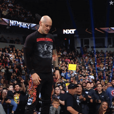 Man In Burning Ship Shirt In Crowd GIF