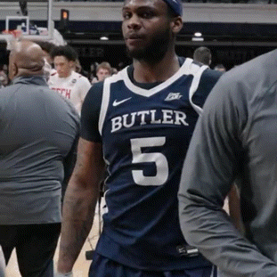 Man in Butler 5 Jersey Stands on Court