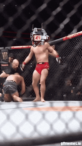 Man In Cage With UFC Helmet GIF