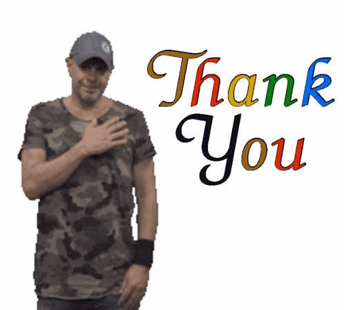 Man in Camo Shirt in Front of Thank You Sign