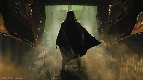 Man In Cape Standing In Dark Hallway GIF