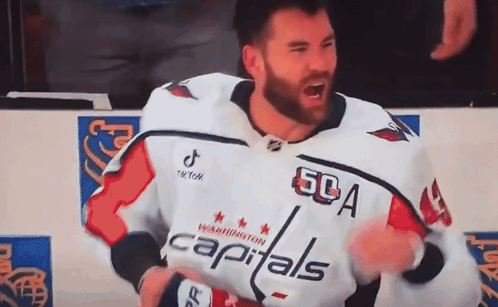 Man In Capitals Jersey Standing On Ice GIF