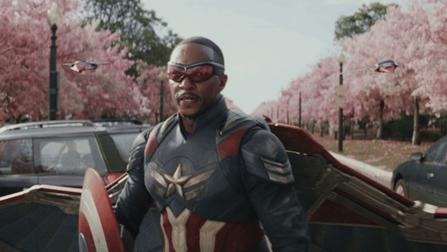 Man in Captain America Costume in Front of Car