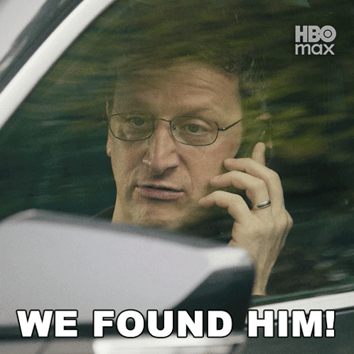 Man In Car On Phone Saying We Found Him GIF