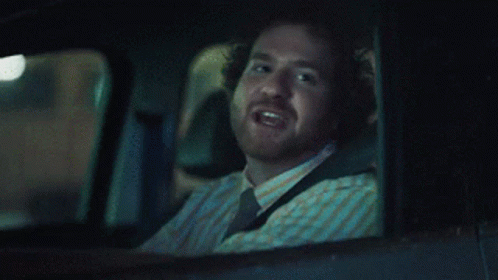 Man in Car Saying Go Get 'Em Tiger