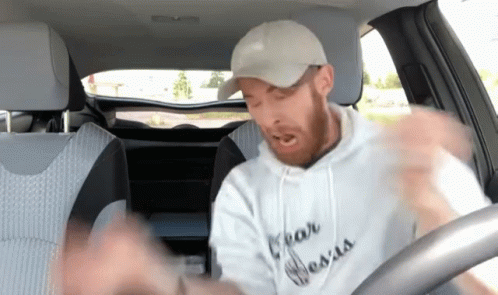 Man in Car Wearing Fear Jesus Hoodie