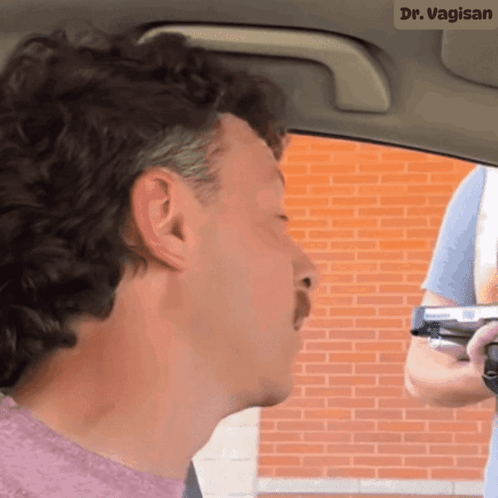 Man in Car with Dr Vagin Name