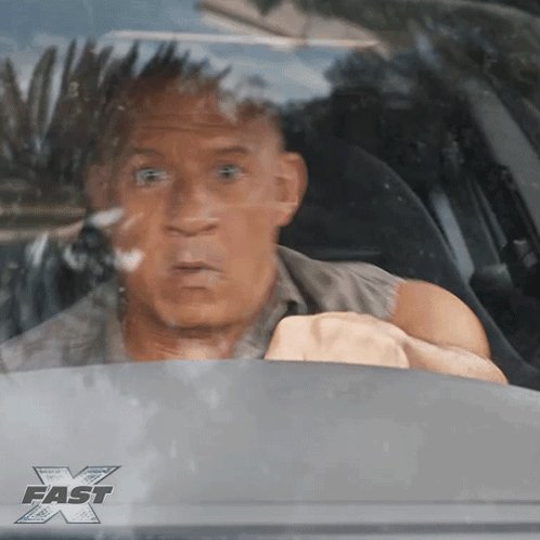 Man in Car with Fast X Sticker