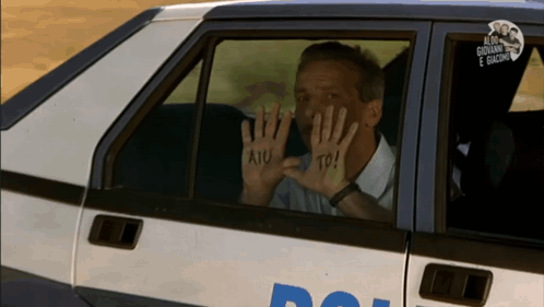 Man In Car With Hands Painted Aiu To GIF