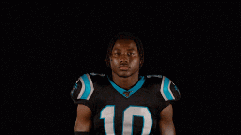Man in Carolina Panthers Jersey Smiling Nah