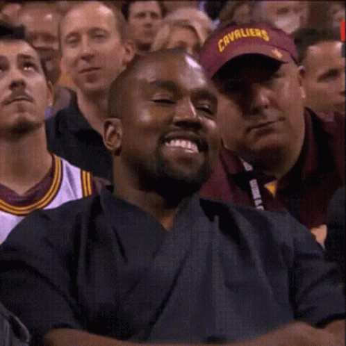 Man in Cavaliers Hat Smiling