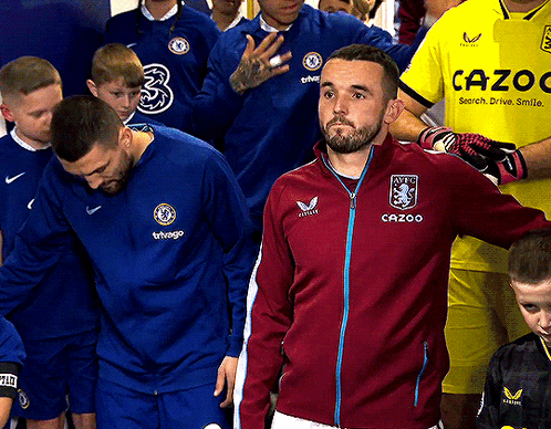 Man in Cazoo Jacket in Line with Players