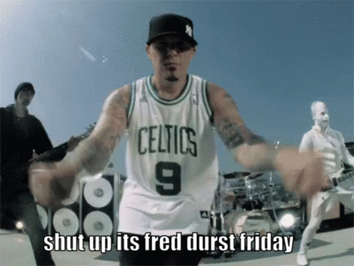 Man in Celtics Jersey Dancing in Front of Band