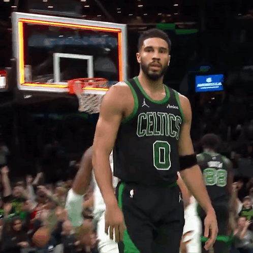 Man In Celtics Jersey Standing In Front Of Basketball Net GIF