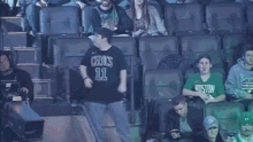 Man in Celtics Shirt Dancing