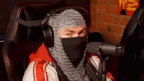Man in Chain Mail at Microphone with Headphones