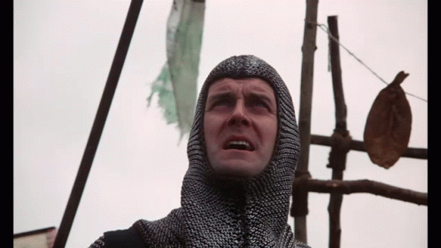 Man In Chain Mail Hood Looking Up GIF