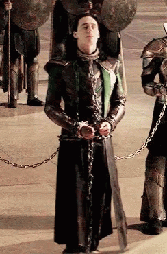 Man In Chains Before Soldiers With Shields GIF