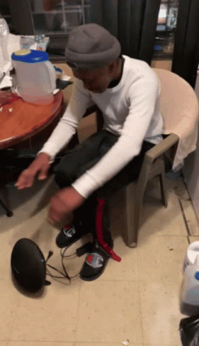 Man in Chair Feet on Speaker Saying Champion