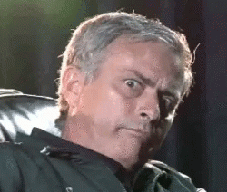 Man in Chair Making Funny Face Eyes Closed