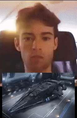 Man in Chair Next to Spaceship Picture