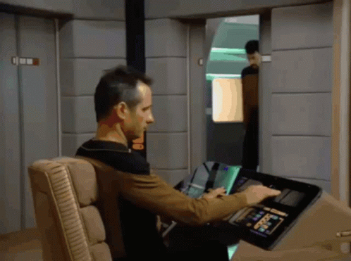 Man in Chair Using Device Saying Command