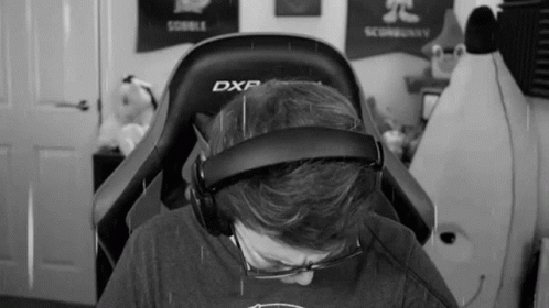 Man In Chair With Headphones And Glasses GIF