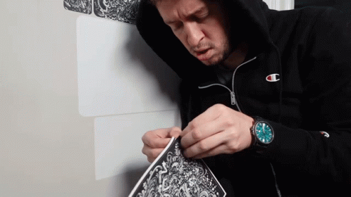 Man in Champion Hoodie Working on Art