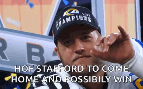 Man in Champions Hat Giving Middle Finger