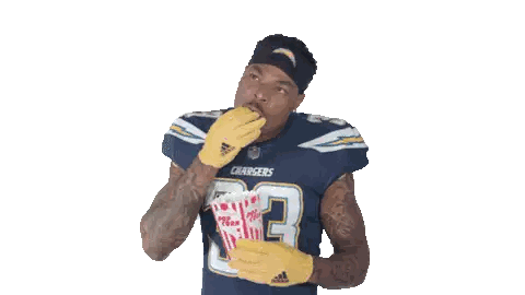 Man in Chargers Jersey Holding Popcorn