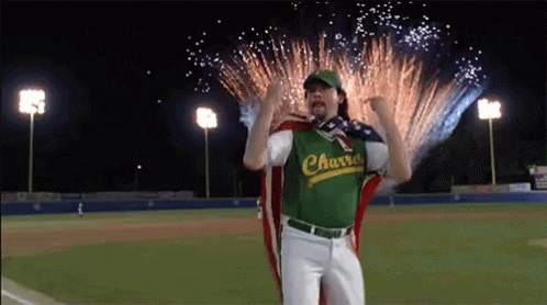 Man in Charro Jersey Standing Before Fireworks