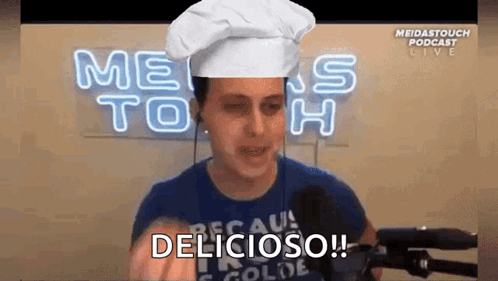 Man in Chef Hat Saying Delicious at Microphone