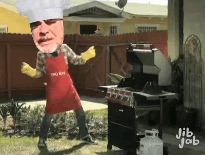 Man in Chef's Hat and Apron Dancing at Grill
