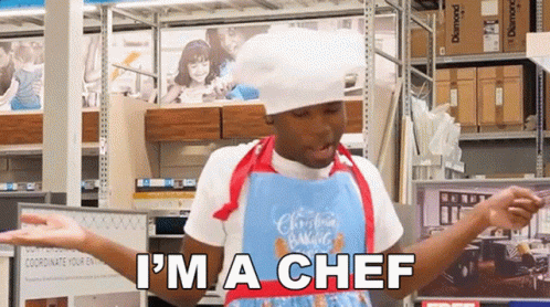 Man in Chef's Hat and Apron Saying I'm a Chef