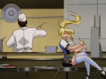 Man in Chef's Hat Cooking Woman With Chopsticks