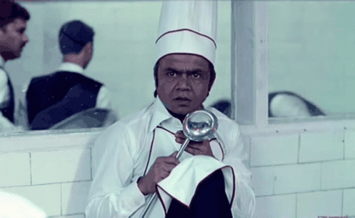 Man in Chef's Hat Holding Ladle