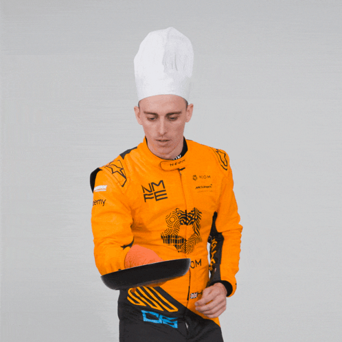 Man in Chef's Hat Holding Pan