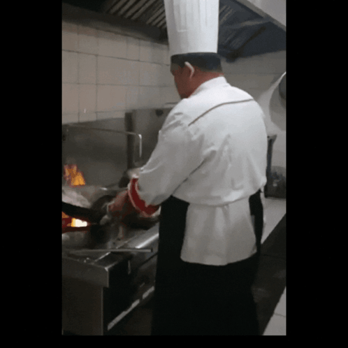 Man in Chef's Hat Preparing Food