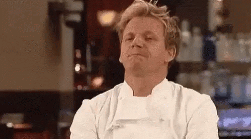 Man In Chef's Uniform Making Funny Face At Bar GIF