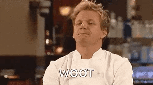 Man in Chef Uniform Says Woot at Bar